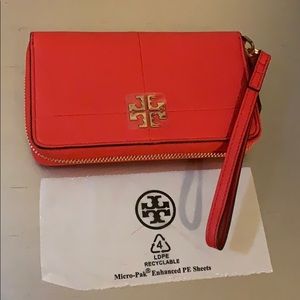 Orange Tory Burch wristlet wallet
